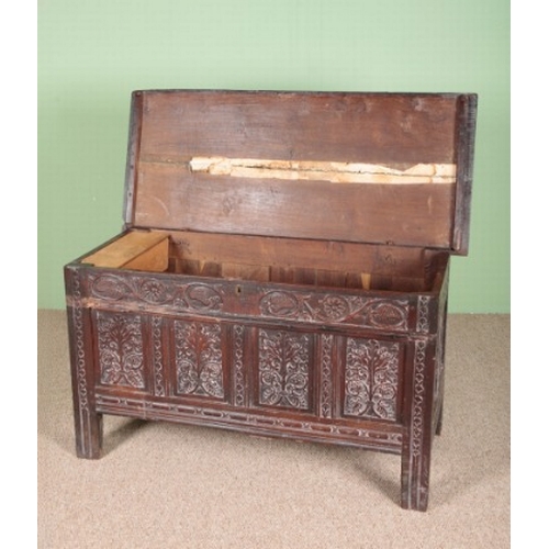 832 - A CHARLES II OAK COFFER

the hinged top opening to an interior fitted with a later 'candle box', the... 