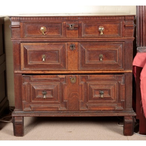 836 - A WILLIAM AND MARY OAK CHEST OF DRAWERS

with dentil frieze above three geometrically moulded long d... 