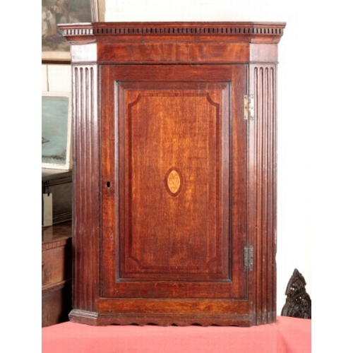 837 - AN OAK CORNER CABINET

late 18th century, with dentil cornice and reeded canted corners, opening to ... 