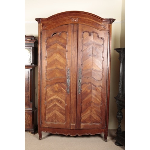 843 - A LARGE FRENCH CHERRY WOOD ARMOIRE

19th century, the moulded cornice over panelled doors with pierc... 