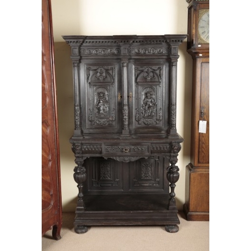 846 - A VICTORIAN GOTHIC REVIVAL EBONISED CABINET ON STAND

19th century, the upper section with a moulded... 