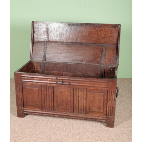 847 - A CONTINENTAL OAK COFFER

late 17th century, the domed top over a panelled front, with iron pear-sha... 