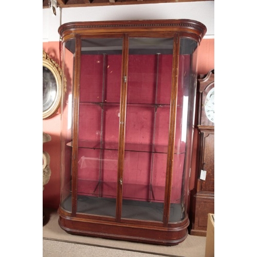 85 - A LARGE EDWARDIAN MAHOGANY SHOP DISPLAY CABINET

the dentil moulded cornice over glazed doors openin... 