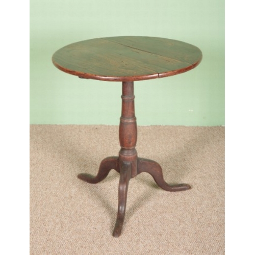 851 - A GEORGE III PROVINCIAL ELM TRIPOD TABLE

the circular tilt-top on a baluster-turned stem with cabri... 