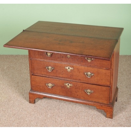 852 - A GEORGE III OAK BACHELOR'S CHEST

mid-18th century, with a hinged top above one short and three lon... 