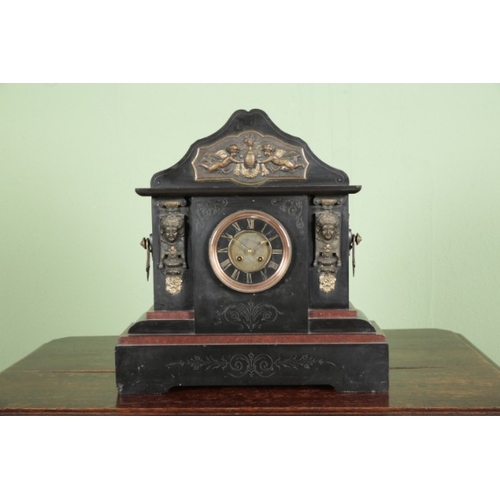 854 - A LARGE VICTORIAN SLATE MANTEL CLOCK

the two train movement striking on a gong, the dial with gilt ... 