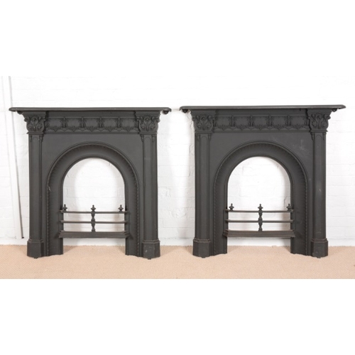 860 - A PAIR OF VICTORIAN CAST IRON FIRE SURROUNDS

of 18th century style with leaf capped friezes and mou... 