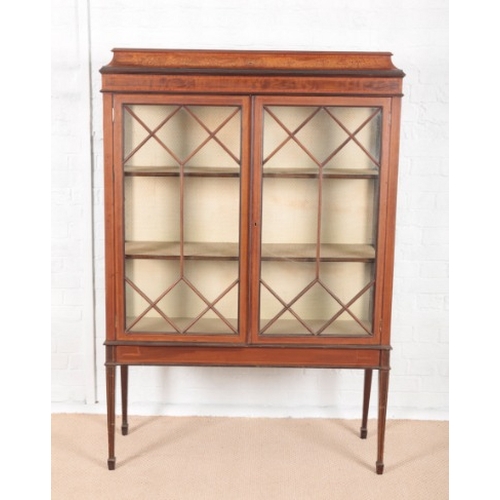 861 - AN EDWARDIAN MAHOGANY DISPLAY CABINET

inlaid with satinwood bandings and boxwood stringings, the co... 