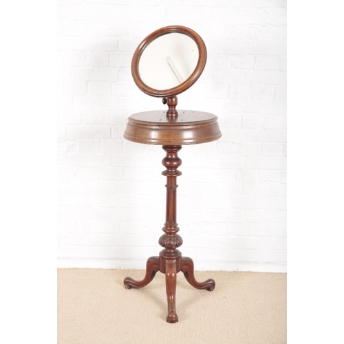 868 - A VICTORIAN MAHOGANY SHAVING STAND

with adjustable circular mirrors, twin lidded compartments under... 