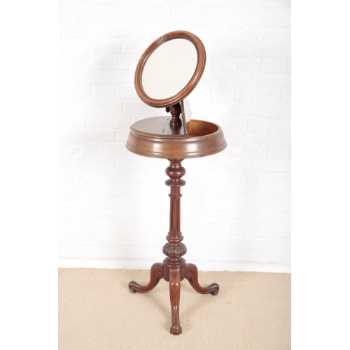 868 - A VICTORIAN MAHOGANY SHAVING STAND

with adjustable circular mirrors, twin lidded compartments under... 