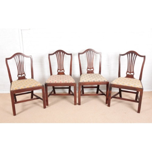 885 - A SET OF FOUR GEORGE III MAHOGANY DINING CHAIRS OF HEPPLEWHITE DESIGN

with arched cresting rails an... 