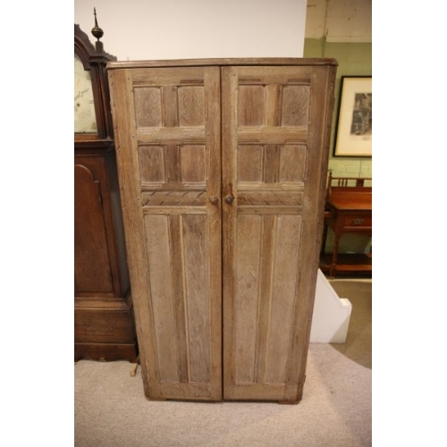 889 - AN ARTS AND CRAFTS LIMED OAK WARDROBE

early 20th century, with rounded front corners, the panelled ... 