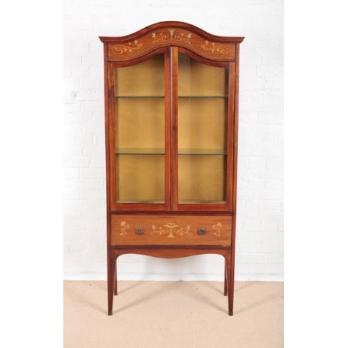 897 - AN ART NOUVEAU MAHOGANY DISPLAY CABINET

with arched top, the frieze inlaid in boxwood and pewter wi... 