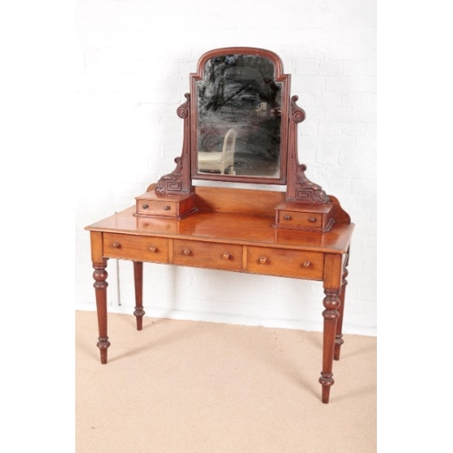 898 - A VICTORIAN MAHOGANY DRESSING TABLE

with arched and stepped mirror on scrolled supports, superstruc... 