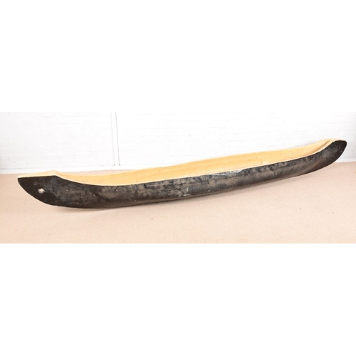 900 - A NATIVE AMERICAN HARDWOOD PAINTED SINGLE CANOE

19th century, 308cm long x 36cm wide