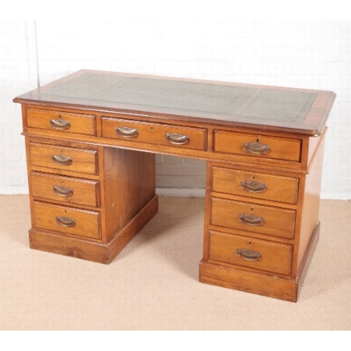 903 - A LATE VICTORIAN STAINED DEAL AND PINE KNEEHOLE DESK

the top inset with green leather, fitted nine ... 