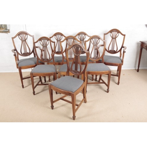 904 - A SET OF EIGHT EDWARDIAN MAHOGANY DINING CHAIRS OF SHERATON STYLE

including two armchairs, the shie... 