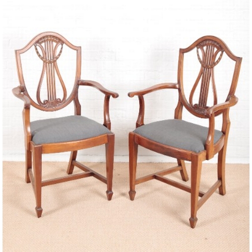 904 - A SET OF EIGHT EDWARDIAN MAHOGANY DINING CHAIRS OF SHERATON STYLE

including two armchairs, the shie... 