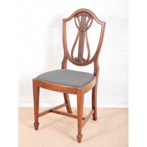 904 - A SET OF EIGHT EDWARDIAN MAHOGANY DINING CHAIRS OF SHERATON STYLE

including two armchairs, the shie... 