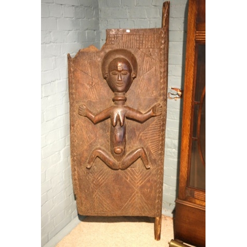 906 - AN OLD AFRICAN CARVED WOOD 'FERTILITY' DOOR

carved in relief with pregnant woman, 167cm high x 69cm... 