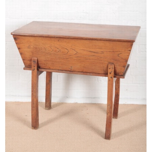 907 - AN ELM DOUGH BIN

18th century,  with rectangular lifting top and angled sides, on square legs, 80cm... 