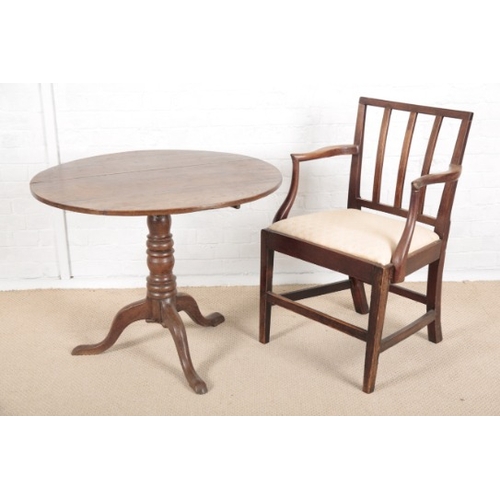 908 - A GEORGE III ELM CIRCULAR TRIPOD TABLE

with lifting top, on turned central column and splayed legs,... 