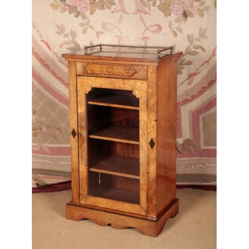 91 - A VICTORIAN WALNUT AND MARQUETRY MUSIC CABINET

the top with a three-quarter turned brass gallery, t... 