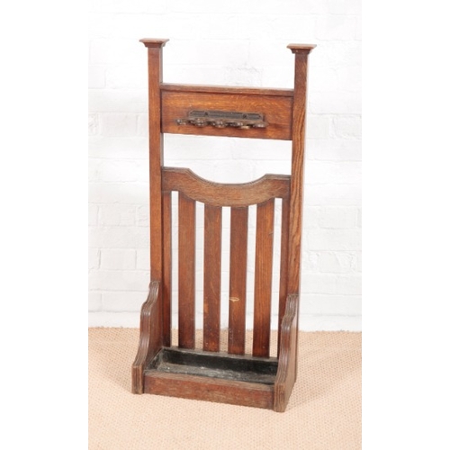 915 - A LATE VICTORIAN ARTS AND CRAFTS SNOOKER CUE OR UMBRELLA STAND

with tall rectangular uprights and s... 