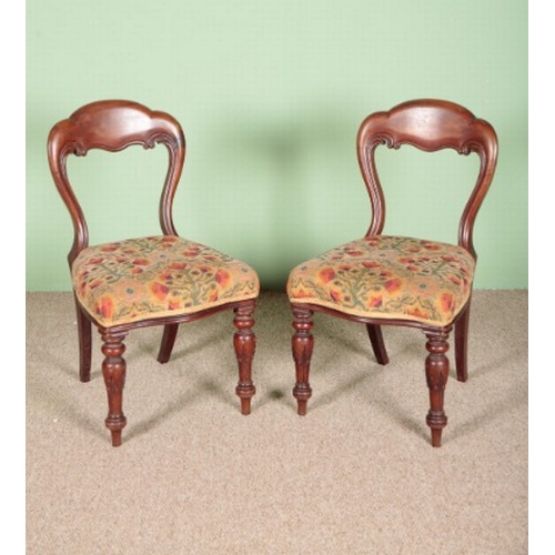 917 - A PAIR OF VICTORIAN MAHOGANY DINING CHAIRS

with upholstered seats and turned carved front legs, 89c... 