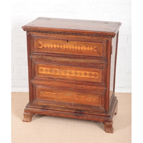 918 - AN UNUSUAL CONTINENTAL WALNUT CABINET

18th century and later, the lifting top with lappet frieze, a... 