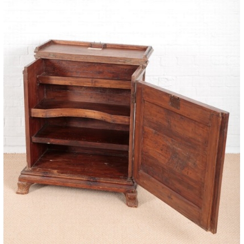 918 - AN UNUSUAL CONTINENTAL WALNUT CABINET

18th century and later, the lifting top with lappet frieze, a... 