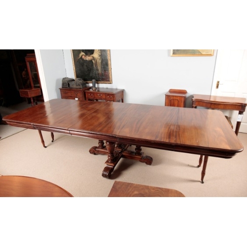 933 - A VICTORIAN MAHOGANY EXTENDING DINING TABLE

with central pedestal base, with two additional leaves,... 