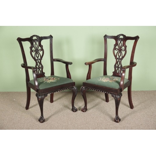 934 - A SET OF EIGHT GEORGE III CHIPPENDALE STYLE DINING CHAIRS

comprising two carvers and six dining cha... 