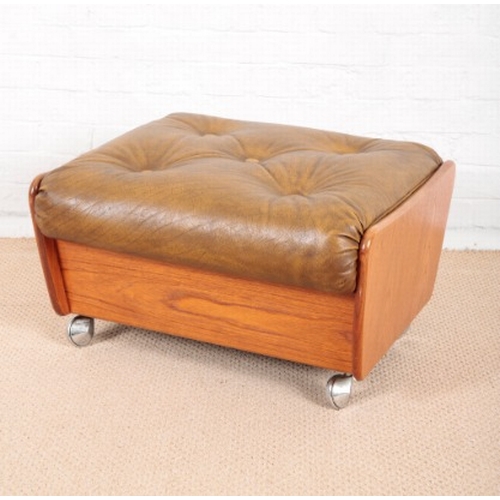 938 - A 1970'S LEATHERETTE FOOTSTOOL

on chrome rolling castors, 36cm high x 66cm wide