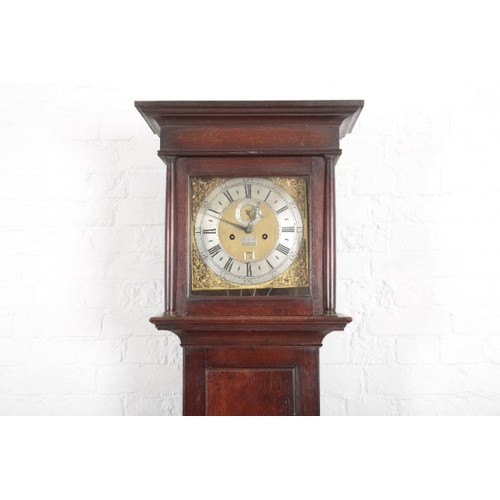 957 - AN OAK LONGCASE CLOCK BY THOMAS MARTIN OF LONDON

18th century, the 27cm square brass dial with silv... 