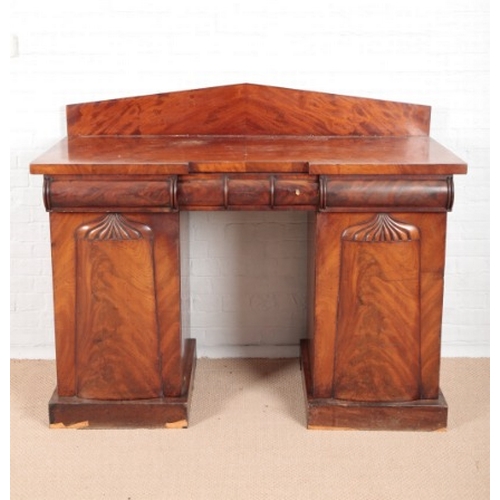 958 - AN EARLY VICTORIAN FIGURED MAHOGANY SIDEBOARD

with apex back, fitted three frieze drawers with roun... 