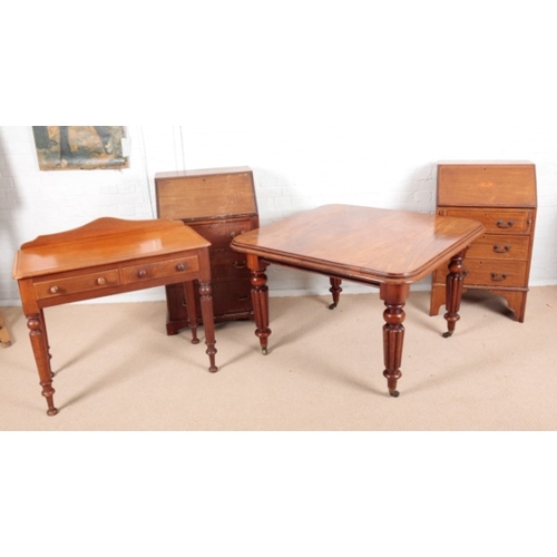 969 - A VICTORIAN MAHOGANY EXTENDING DINING TABLE

the stepped and moulded top with rounded corners, on tu... 