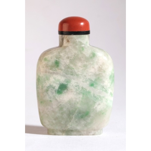 10 - A CHINESE JADEITE SNUFF BOTTLE

19th century, carved on one side with birds amongst foliage, 6cm hig... 