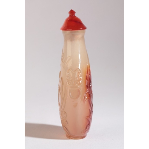 102 - A CHINESE AGATE SNUFF BOTTLE

19th century, both sides finely carved with archaic dragons, mask and ... 