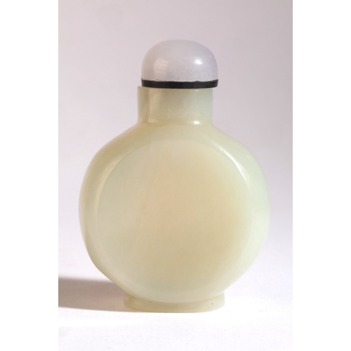 104 - A CHINESE JADE SNUFF BOTTLE

18th century, of flattened circular form, 6cm high overall

The Dick Ha... 