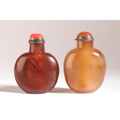 105 - A CHINESE AGATE SNUFF BOTTLE

19th century, of spade shape with pale natural inclusions, 6cm high ov... 