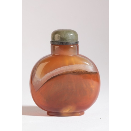 110 - A CHINESE AGATE SNUFF BOTTLE

19th century, the ochre skin to the front carved with two boys seated ... 