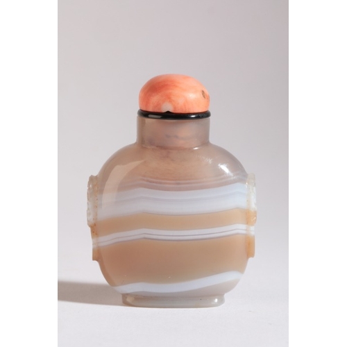 112 - A CHINESE AGATE SNUFF BOTTLE

19th century, the light brown agate with continuous white band, carved... 