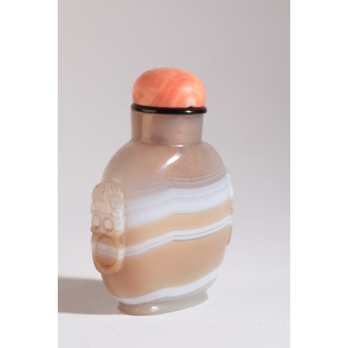 112 - A CHINESE AGATE SNUFF BOTTLE

19th century, the light brown agate with continuous white band, carved... 