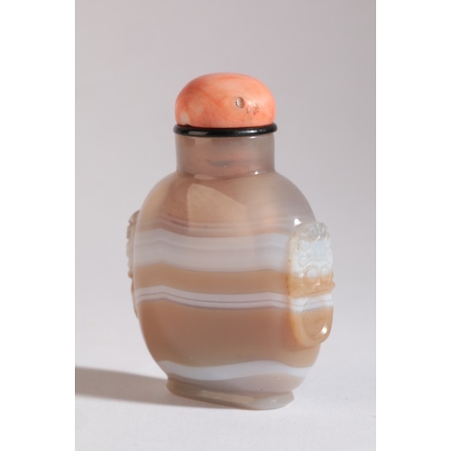 112 - A CHINESE AGATE SNUFF BOTTLE

19th century, the light brown agate with continuous white band, carved... 