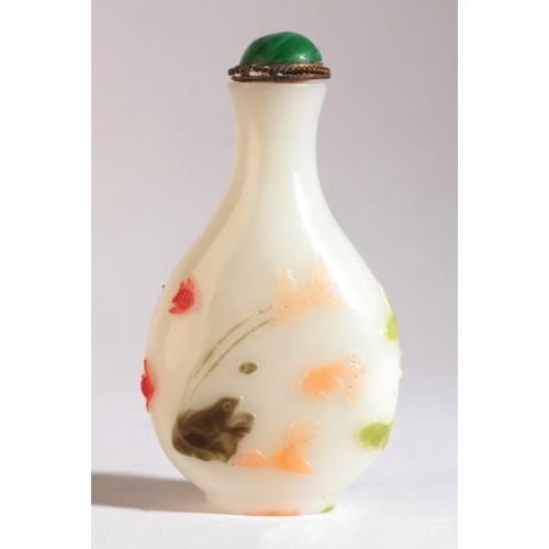 114 - A CHINESE GLASS SNUFF BOTTLE

19th/20th century, of pear shaped form, the coloured glass carved with... 