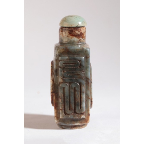 117 - A CHINESE STONE SNUFF BOTTLE

19th century, carved with an old coin motif to the front and reverse, ... 