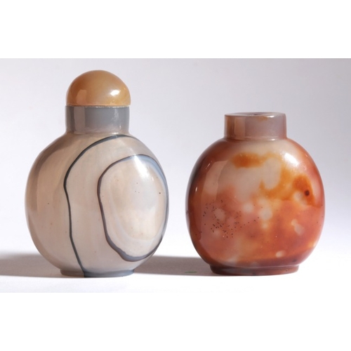 126 - A CHINESE AGATE SNUFF BOTTLE

likely 18th/19th century, the grey body of circular form with two conc... 