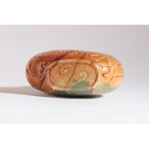 127 - A CHINESE JADE SNUFF BOTTLE

probably 19th century, the russet skin carved with horses in a mountain... 