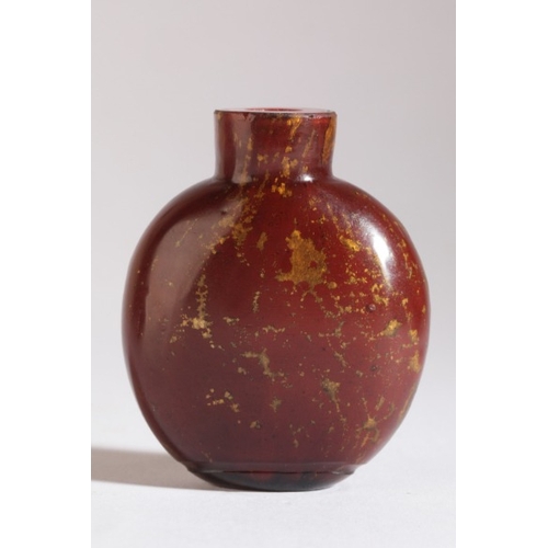 129 - A CHINESE RED AVENTURINE GLASS SNUFF BOTTLE

probably 19th century, of bulbous form, 5.5cm high 

Th... 